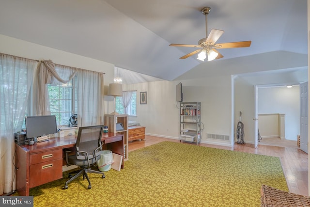 office featuring lofted ceiling, ceiling fan, and hardwood / wood-style floors