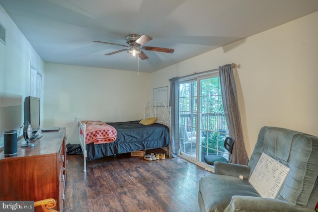 bedroom featuring dark hardwood / wood-style flooring, ceiling fan, and access to exterior