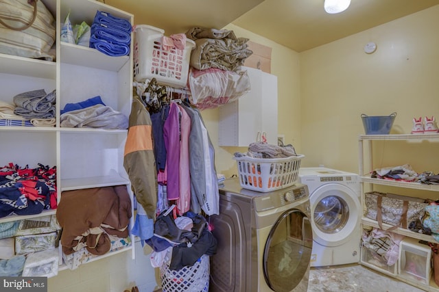 washroom featuring washing machine and dryer