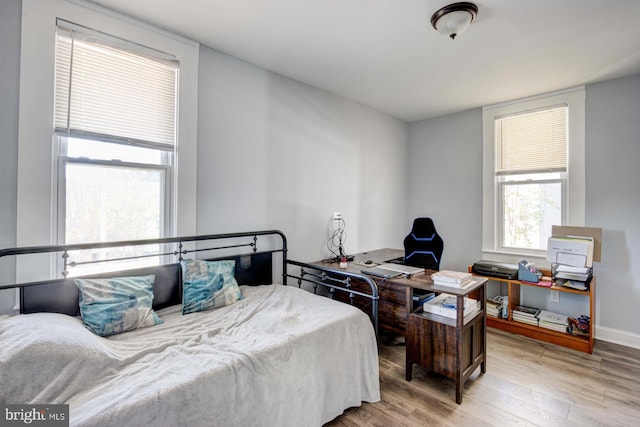 bedroom with light hardwood / wood-style flooring