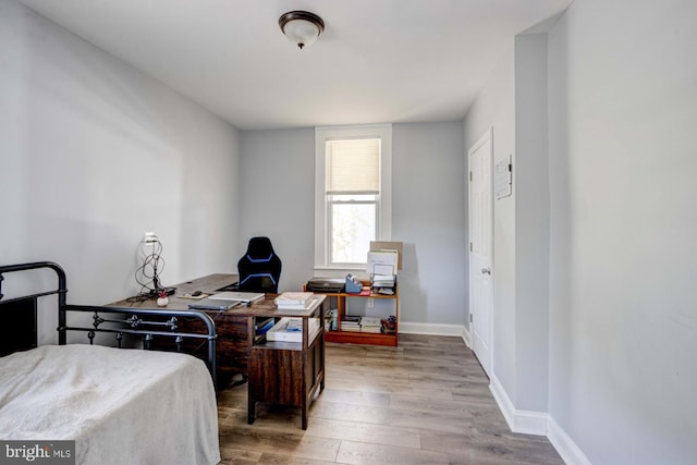 bedroom with hardwood / wood-style floors