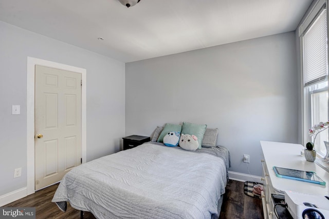 bedroom featuring dark wood-type flooring