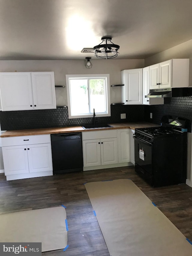 kitchen featuring white cabinets, sink, dark hardwood / wood-style flooring, and black appliances