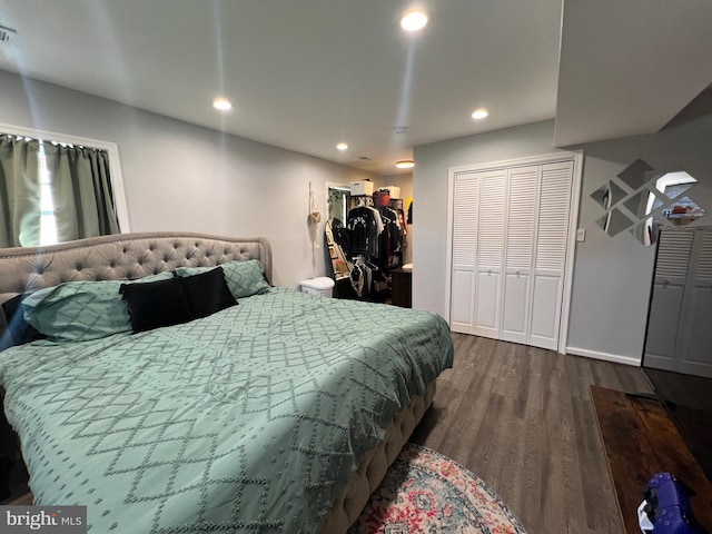 bedroom featuring a closet and dark hardwood / wood-style floors