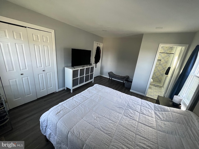 bedroom with a closet and dark hardwood / wood-style flooring