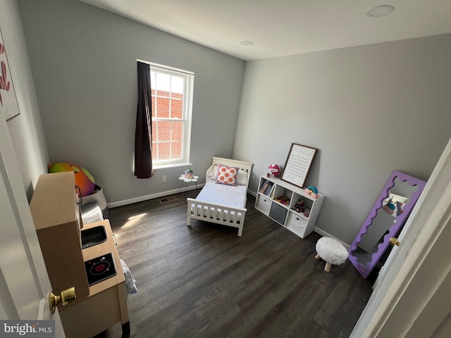 sitting room with dark hardwood / wood-style floors