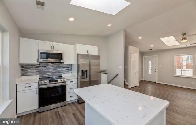 kitchen with white cabinetry, dark wood-type flooring, ceiling fan, and stainless steel appliances