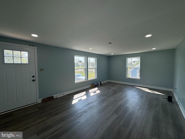 foyer entrance with dark wood-type flooring