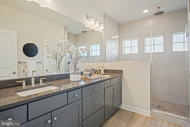 bathroom featuring vanity and a tile shower