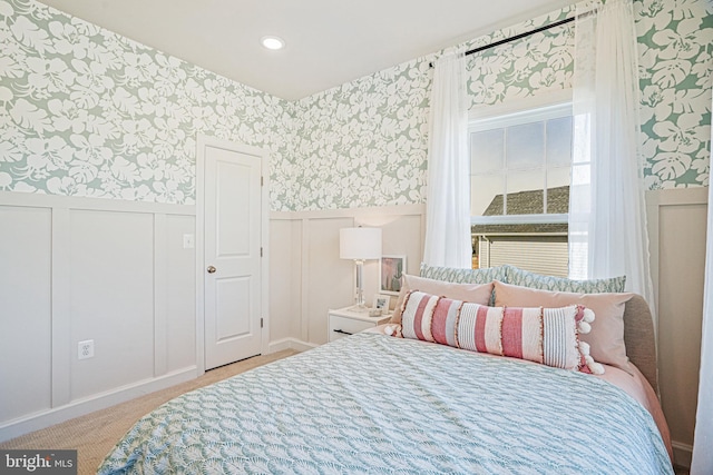 bedroom featuring light colored carpet