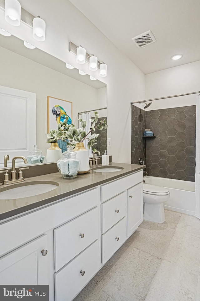 full bathroom featuring shower / bath combo with shower curtain, vanity, and toilet