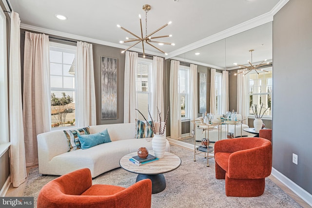 living room featuring ornamental molding and a notable chandelier