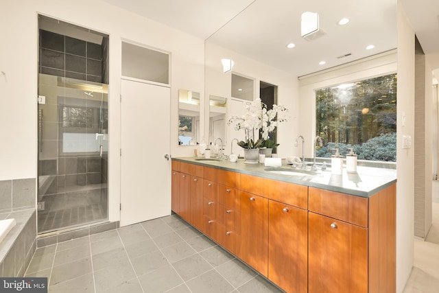 bathroom with vanity, shower with separate bathtub, and tile patterned flooring