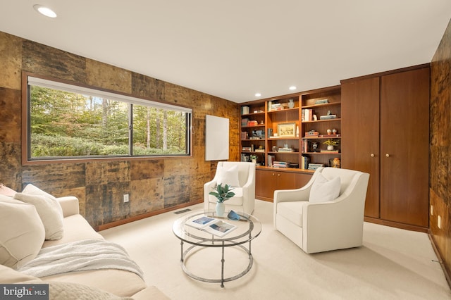 carpeted living room with built in shelves