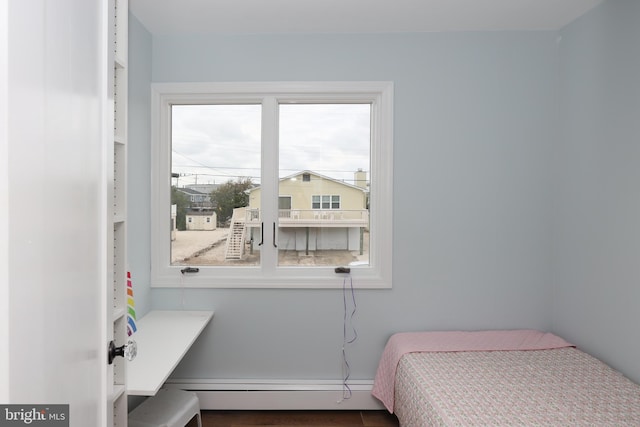 bedroom featuring baseboard heating