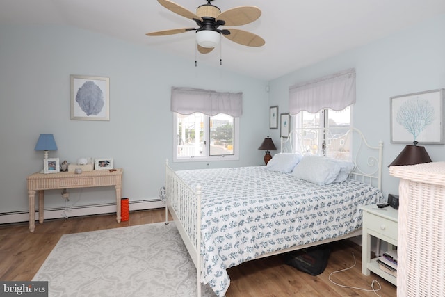 bedroom featuring ceiling fan, lofted ceiling, light hardwood / wood-style floors, and multiple windows