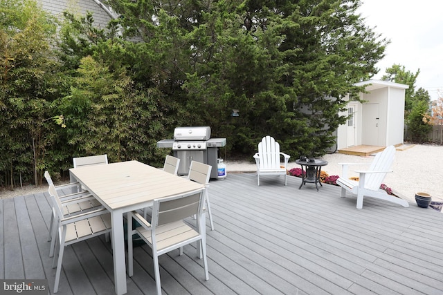 wooden terrace featuring area for grilling