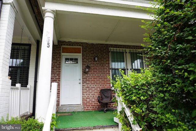 doorway to property with a porch