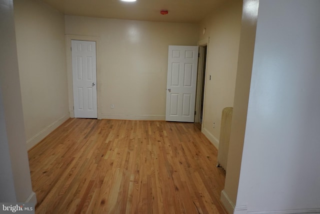 unfurnished room featuring light hardwood / wood-style floors