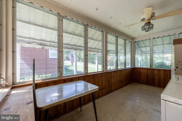 sunroom with ceiling fan and a healthy amount of sunlight