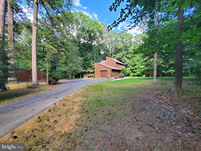 view of front of home featuring driveway and a garage