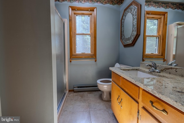 bathroom featuring a shower with shower door, toilet, tile patterned floors, baseboard heating, and vanity