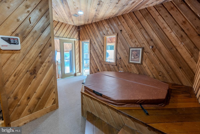 bonus room with lofted ceiling, carpet flooring, wooden ceiling, and wood walls