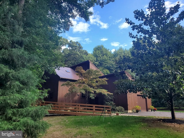 rear view of house with a yard