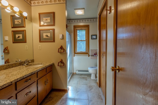 bathroom with toilet, baseboard heating, vanity, and a shower with door