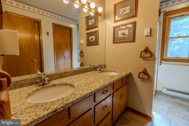 bathroom featuring baseboard heating, vanity, and tile patterned flooring