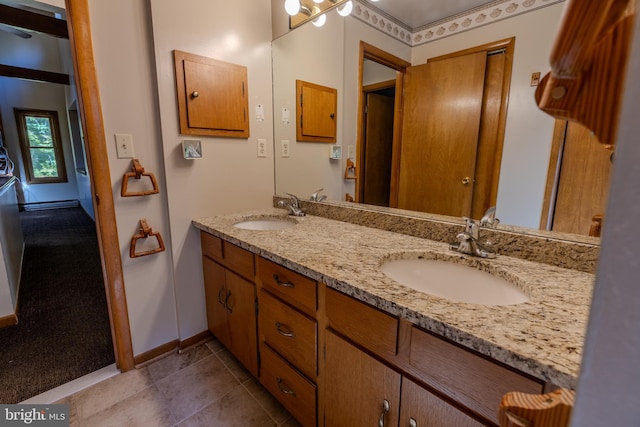 bathroom with vanity and tile patterned flooring