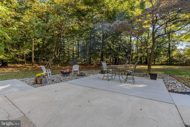 view of patio / terrace featuring an outdoor fire pit