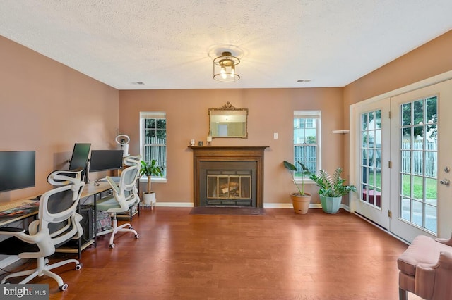 office featuring a textured ceiling and hardwood / wood-style floors