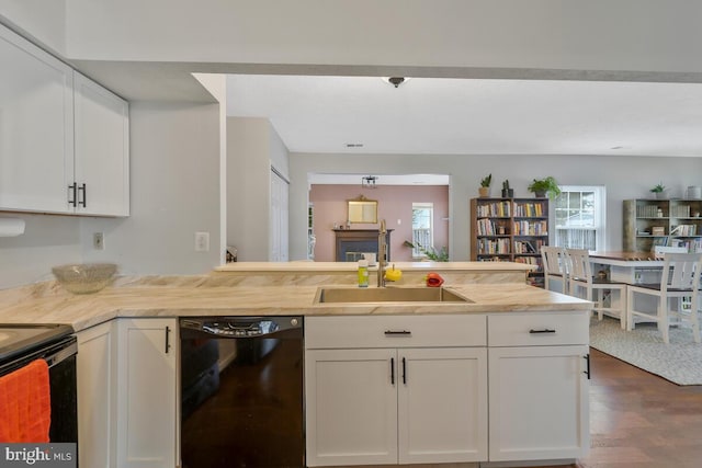 kitchen featuring black appliances, white cabinets, sink, and dark hardwood / wood-style flooring