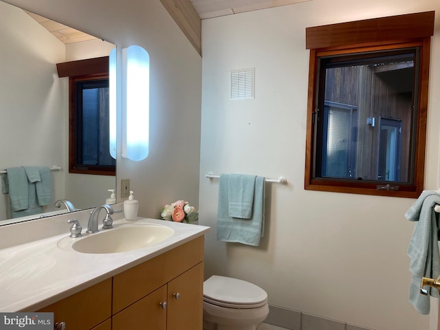 bathroom with vanity and toilet