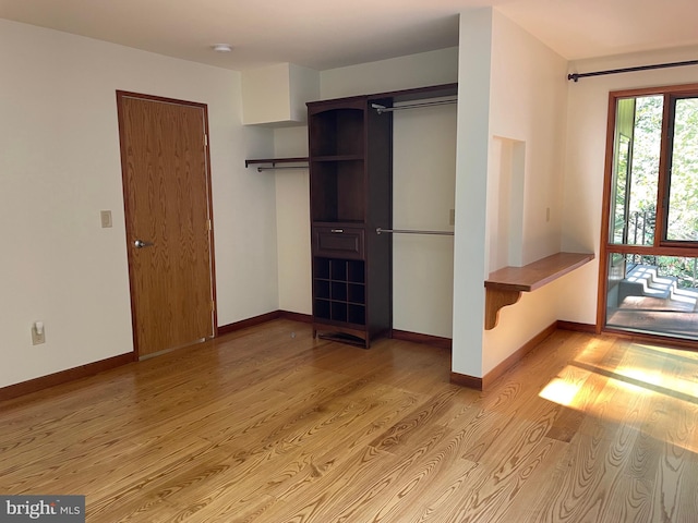 unfurnished bedroom with light wood-type flooring