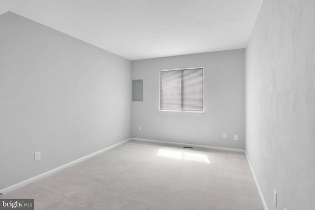 unfurnished room with light colored carpet