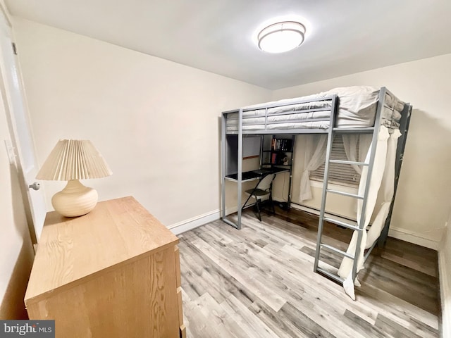 bedroom with light hardwood / wood-style floors