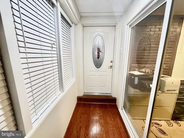 doorway featuring dark hardwood / wood-style flooring