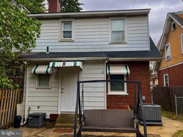 view of front of property with central AC unit