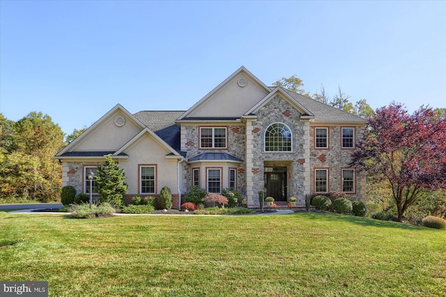 view of front of property with a front lawn and stucco siding