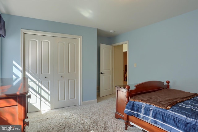 carpeted bedroom with a closet