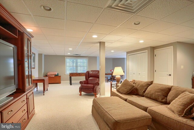 carpeted living area featuring visible vents and recessed lighting