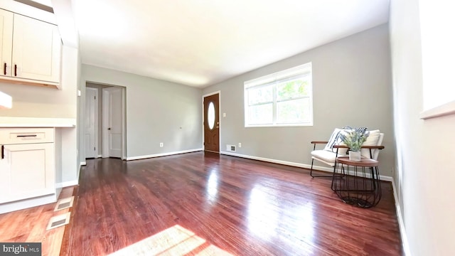 living room with dark hardwood / wood-style floors