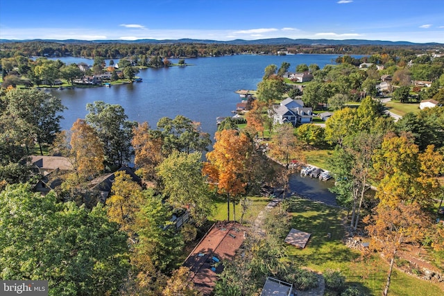 bird's eye view with a water and mountain view