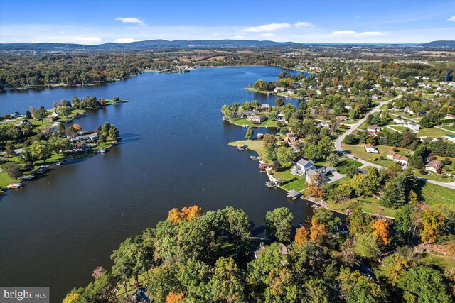 aerial view featuring a water and mountain view