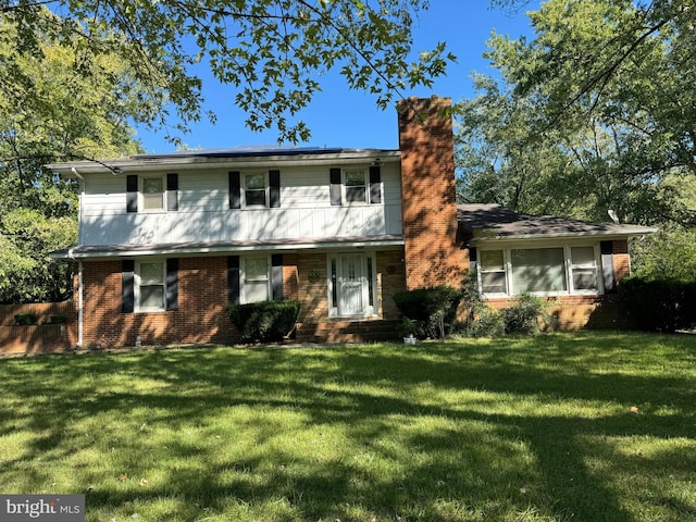 view of front facade featuring a front yard