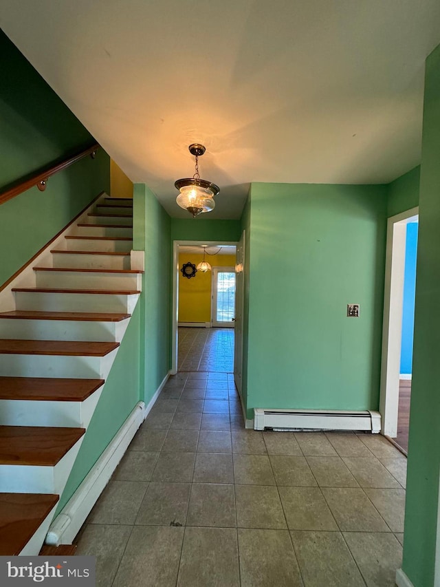 corridor with baseboard heating and tile patterned flooring