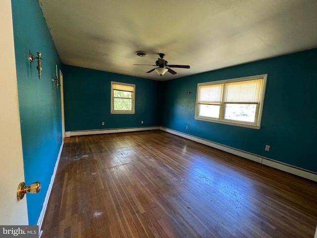 unfurnished room featuring hardwood / wood-style floors, baseboard heating, and ceiling fan