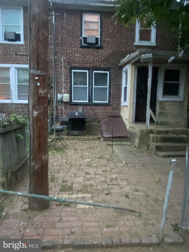 view of front of property with cooling unit